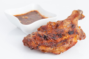 Delicious Thai style grilled chicken drumstick with spicy sauce