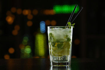 Glass of cocktails on bar background