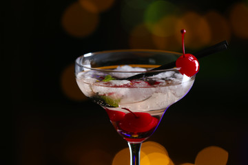 Glass of cocktails on bar background