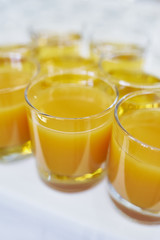 Glasses of orange or peach juice