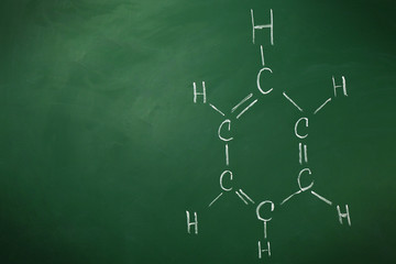 Molecule models and formulas on blackboard background