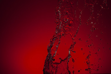 Texture of water on red background