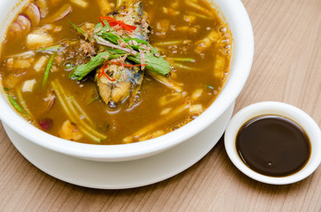 A bowl of assam laksa with prawn paste