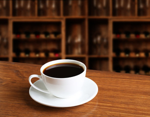 Cup of coffee on table in coffee shop