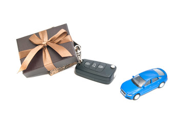 brown gift box, car and keys