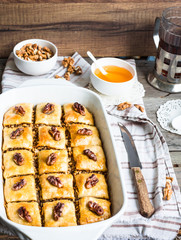Turkish homemade baklava with honey and walnuts, selective focus