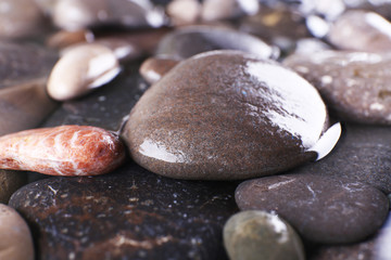 Fototapeta na wymiar Wet sea pebbles background