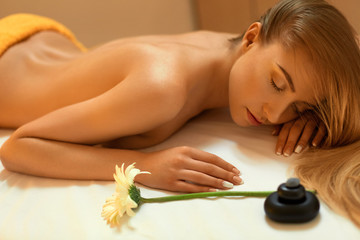 Spa Woman. Blonde Getting Recreation Massage in Spa Salon. Welln