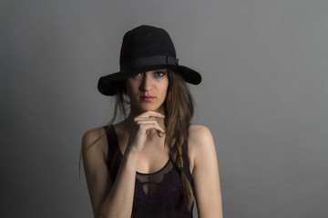 Fototapeta na wymiar Beautiful girl with black hat.