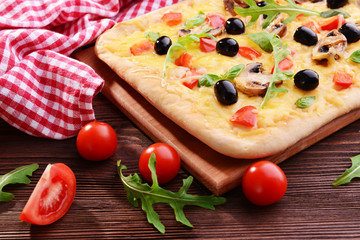 Delicious homemade pizza on table close-up