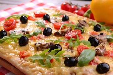 Delicious homemade pizza on table close-up
