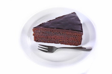 Piece of chocolate cake isolated on white