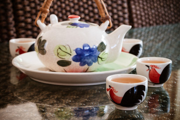 Traditional chinese tea cups and tea pot on the table