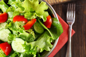 fresh vegetable salad in bowl on table close up