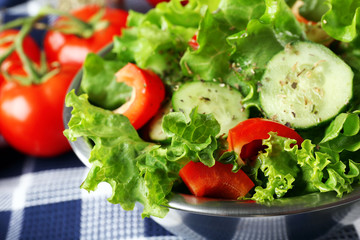 fresh vegetable salad in bowl on table close up