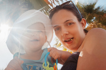 Obraz premium Mother And Baby Boy At The Beach