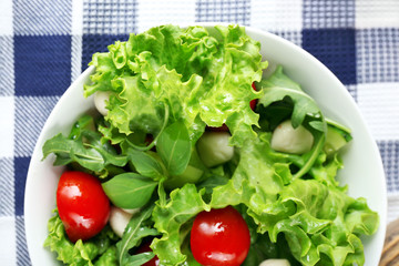 fresh vegetable salad in bowl on table close up
