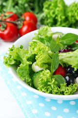 fresh vegetable salad in bowl on table close up