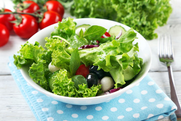 fresh vegetable salad in bowl on table close up