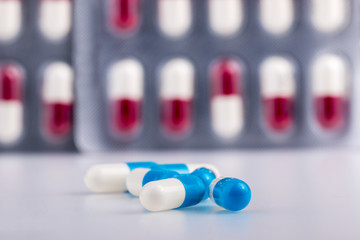 panels of capsules on white