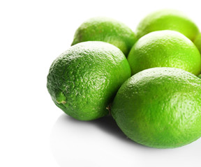 Group of fresh limes isolated on white