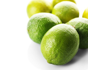 Group of fresh limes isolated on white