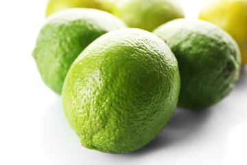 Group of fresh limes isolated on white