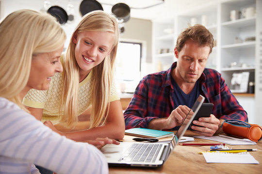 Daughter Helping Her Parents With New Technology