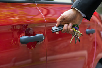Man Opening The Car Door With Remote Control