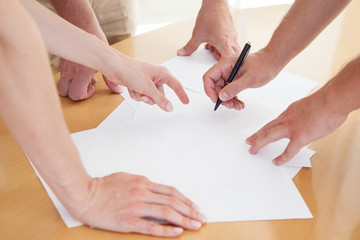 Closeup of business people hands during teamwork