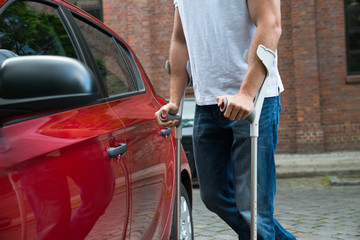 Disabled Man Opening Door Of A Car