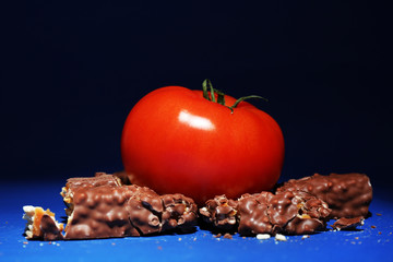 Concept of healthy and unhealthy food on dark background