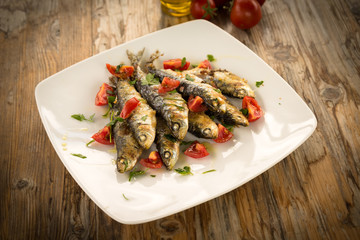 Sardine gratinate con pomodoro fresco e prezzemolo