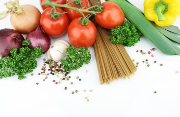 Obraz na płótnie Canvas Pasta spaghetti with vegetables and herbs on a white background.