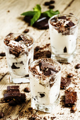 Dessert of dark chocolate, coffee and ice cream in small glasses