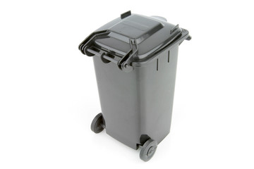 Grey garbage wheelie bin with a closed lid on a white background.