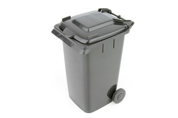 Grey garbage wheelie bin with a closed lid on a white background.