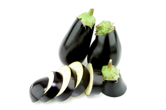 Large eggplants and a sliced one.
