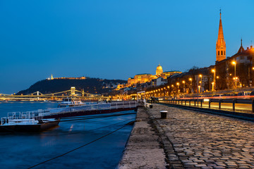 Danube waterfront in Pest with a view over Chain Bridge and Buda