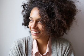 beautiful black woman smiling and looking away