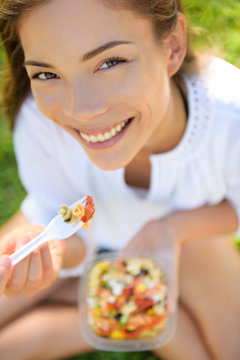 Woman Eating Gluten Free Pasta Salad