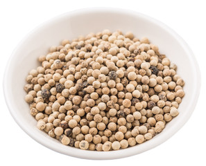 White pepper in white bowl over white background