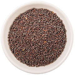 Black mustard seed in white bowl over white background
