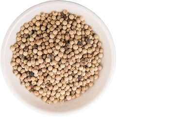White pepper in white bowl over white background