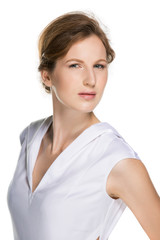 Fashion portrait of a girl in the beautiful designer white dress