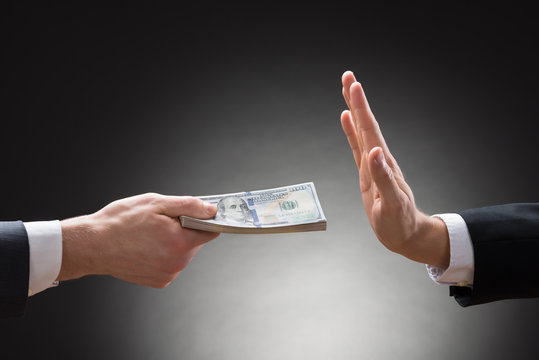 Businessman Hand Rejecting An Offer Of Money