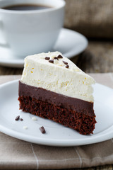 Vanilla cheesecake slice on wooden background.