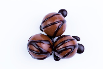 Chocolate candies on a white background.