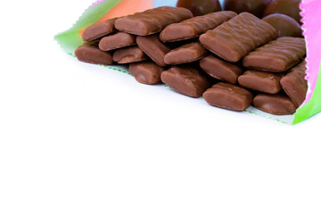 Chocolate candies on a white background.