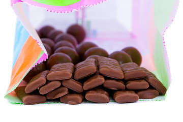 Chocolate candies on a white background.